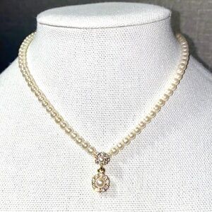 Pearl Necklace With Two Pearl Center Pieces Both Surround By Rhinestones